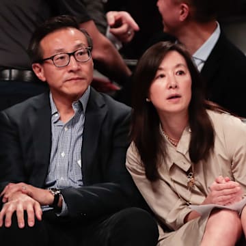 May 9, 2019; New York City, NY, USA; Joe Tsai (left) looks on during the second half of the preseason WNBA game between the New York Liberty and the China National Team at Barclays Center.  Mandatory Credit: Vincent Carchietta-Imagn Images