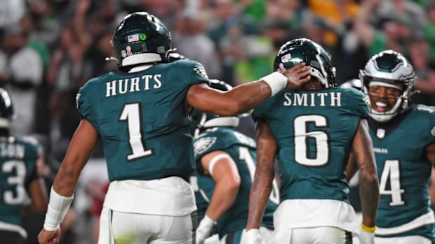 Philadelphia Eagles quarterback Jalen Hurts (1) and wide receiver DeVonta Smith (6) celebrate touchdown during the second qua