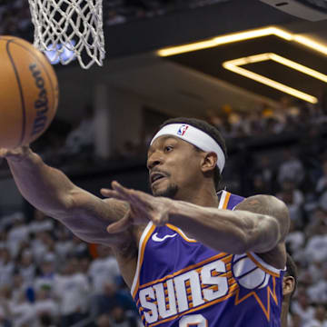 Apr 20, 2024; Minneapolis, Minnesota, USA; Phoenix Suns guard Bradley Beal (3) drives to the basket and passes the ball against the Minnesota Timberwolves in the first half during game one of the first round for the 2024 NBA playoffs at Target Center. Mandatory Credit: Jesse Johnson-Imagn Images