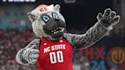 Apr 6, 2024; Glendale, AZ, USA; North Carolina State Wolfpack mascot performs against the Purdue Boilermakers in the semifinals of the men's Final Four of the 2024 NCAA Tournament at State Farm Stadium. Mandatory Credit: Robert Deutsch-Imagn Images