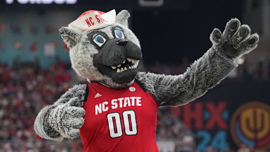 Apr 6, 2024; Glendale, AZ, USA; North Carolina State Wolfpack mascot performs against the Purdue Boilermakers in the semifinals of the men's Final Four of the 2024 NCAA Tournament at State Farm Stadium. Mandatory Credit: Robert Deutsch-Imagn Images