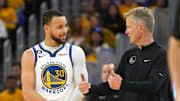 Apr 23, 2023; San Francisco, California, USA; Golden State Warriors guard Stephen Curry (30) talks with head coach Steve Kerr during the third quarter of game four of the 2023 NBA playoffs against the Sacramento Kings at Chase Center. Mandatory Credit: Darren Yamashita-Imagn Images