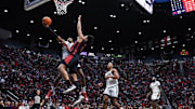 San Diego State Aztecs guard Micah Parrish (3) is fouled while going to the basket against UNLV Rebels forward Jalen Hill (1) during the first half at Viejas Arena. 
