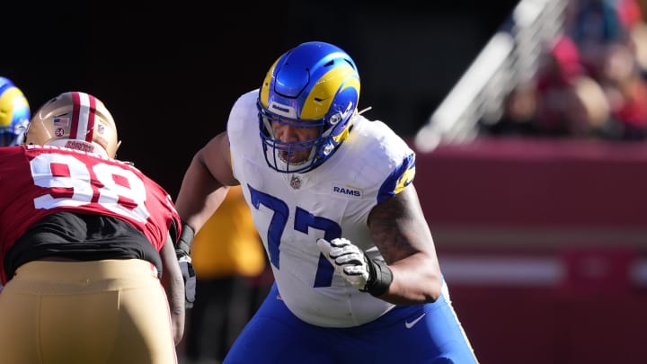 Jan 7, 2024; Santa Clara, California, USA; Los Angeles Rams offensive tackle Alaric Jackson (77) blocks San Francisco 49ers defensive tackle Javon Hargrave (98) during the first quarter at Levi's Stadium. Mandatory Credit: Darren Yamashita-USA TODAY Sports