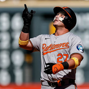 Sep 1, 2024; Denver, Colorado, USA; Baltimore Orioles catcher James McCann (27) reacts from second on a double in the ninth inning against the Colorado Rockies at Coors Field. 