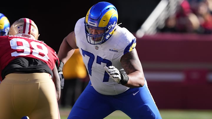 Jan 7, 2024; Santa Clara, California, USA; Los Angeles Rams offensive tackle Alaric Jackson (77) blocks San Francisco 49ers defensive tackle Javon Hargrave (98) during the first quarter at Levi's Stadium. Mandatory Credit: Darren Yamashita-Imagn Images