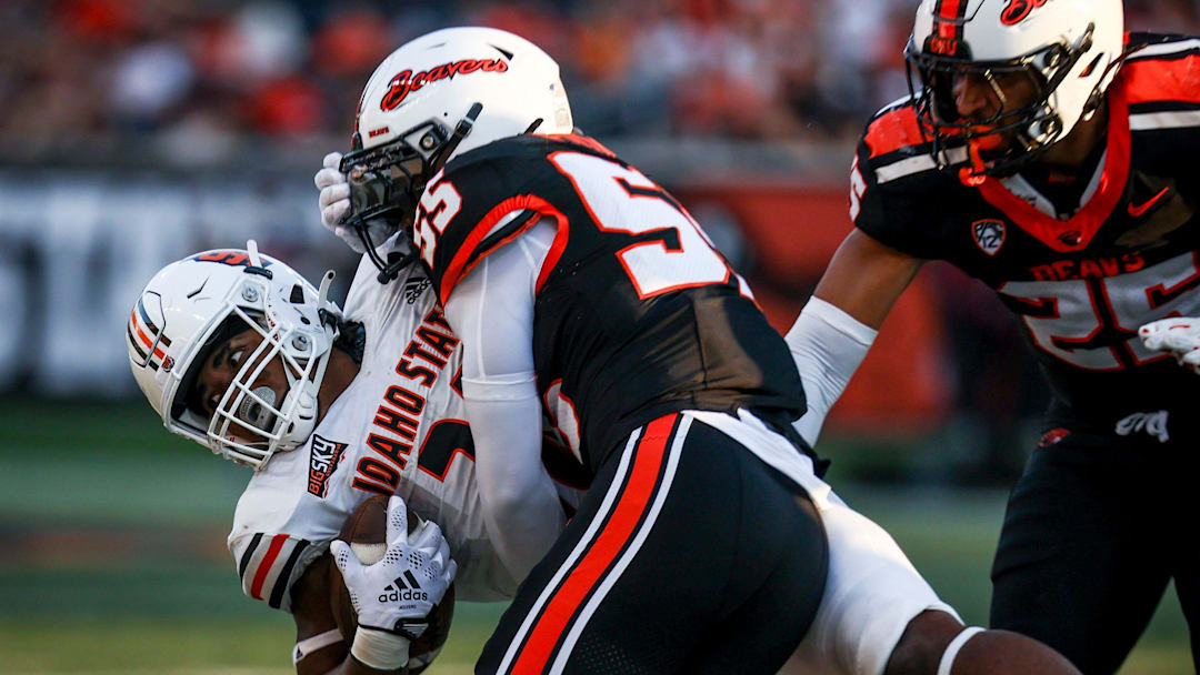 Oregon State Beavers linebacker Dexter Foster (55) takes down Idaho State Bengals running back Dason Brooks (28) during the second half on Saturday, Aug. 31, 2024 at Reser Stadium in Corvallis, Ore.