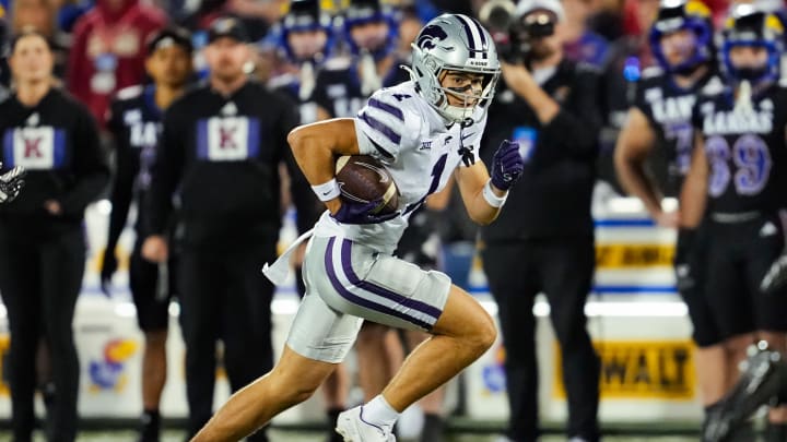 Nov 18, 2023; Lawrence, Kansas, USA; Kansas State Wildcats wide receiver Jayce Brown (1) runs with the ball during the second half against the Kansas Jayhawks at David Booth Kansas Memorial Stadium. Mandatory Credit: Jay Biggerstaff-USA TODAY Sports