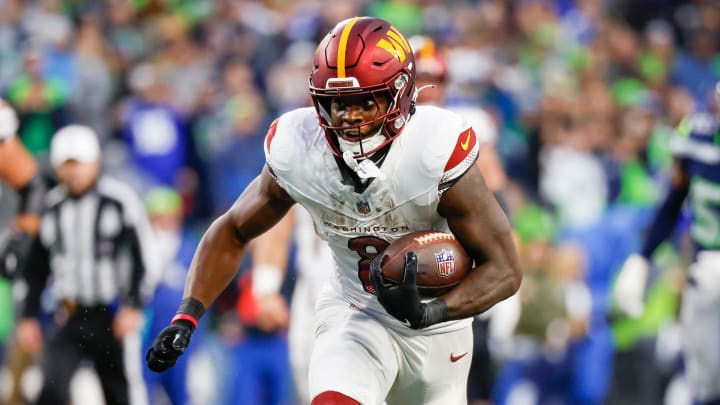 Nov 12, 2023; Seattle, Washington, USA; Washington Commanders running back Brian Robinson Jr. (8) runs for yards after the catch against the Seattle Seahawks during the fourth quarter at Lumen Field. Mandatory Credit: Joe Nicholson-USA TODAY Sports