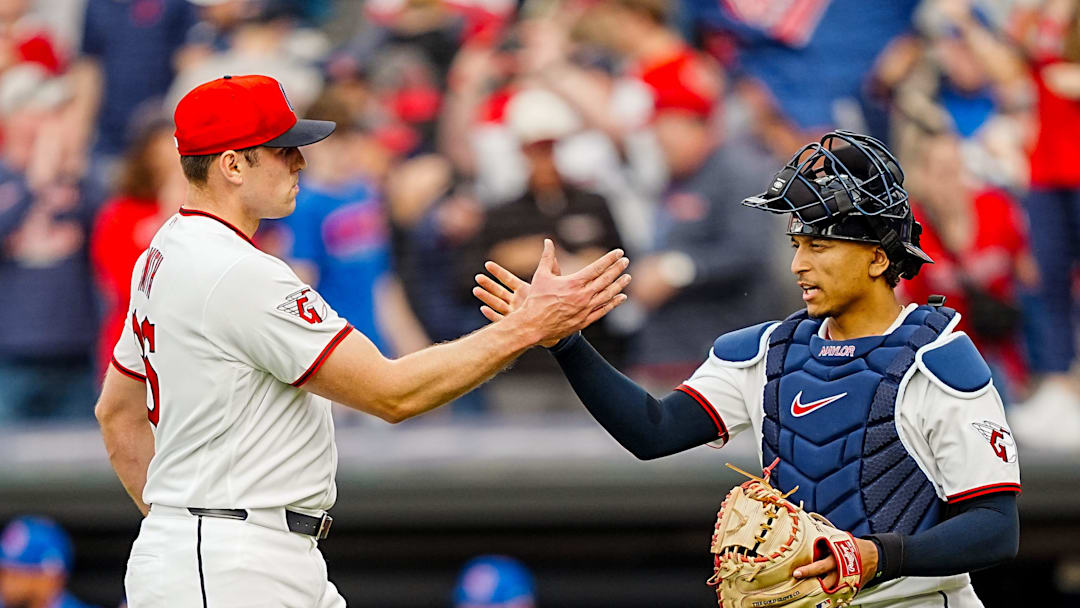Cleveland Guardians pitcher Cade Smith, left, and catcher Bo Naylor celebrate a win over the Chicago Cubs in the home opener April 4, 2026, in Cleveland.