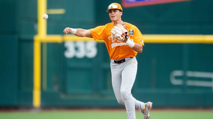 Tennessee's Dean Curley (23) throws to first during a NCAA College World Series game between Tennessee and Florida State at Charles Schwab Field in Omaha, Neb., on Wednesday, June 19, 2024.