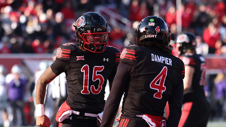 Utah Utes quarterbacks Byrd Ficklin and Devon Dampier celebrate a touchdown.