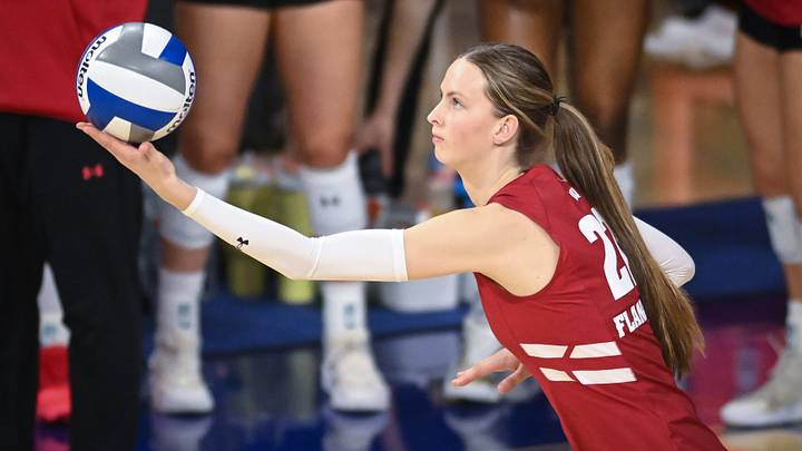 Wisconsin outside hitter Audrey Flanagan (22) serves against Marquette in a spring match Monday, March 23, 2026, at the Al McGuire Center in Milwaukee, Wisconsin.
