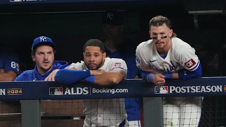 Oct 10, 2024; Kansas City, Missouri, USA; Kansas City Royals first baseman Vinnie Pasquantino (9), outfielder Tommy Pham (22) and shortstop Bobby Witt Jr. (7) watch play from the dugout during the seventh inning against the New York Yankees during game four of the ALDS for the 2024 MLB Playoffs at Kauffman Stadium. Mandatory Credit: Denny Medley-Imagn Images