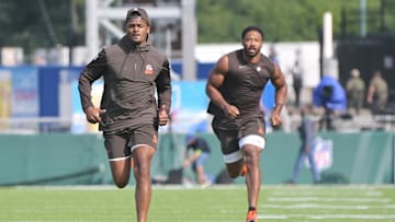 Aug 3, 2023; Canton, Ohio, USA; Cleveland Browns quarterback Deshaun Watson, left, and defensive end Myles Garrett warm up before the game between the Browns and the New York Jets at Tom Benson Hall of Fame Stadium. Mandatory Credit: Ken Blaze-Imagn Images