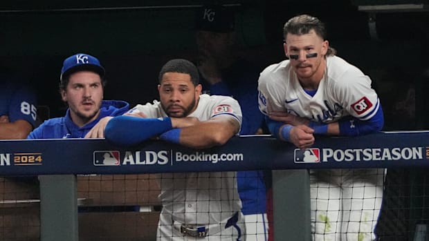 Kansas City Royals first baseman Vinnie Pasquantino, outfielder Tommy Pham and shortstop Bobby Witt Jr. watch play.