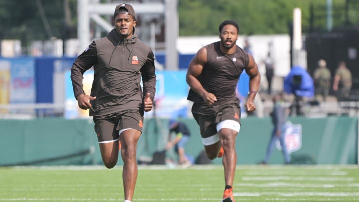 Aug 3, 2023; Canton, Ohio, USA; Cleveland Browns quarterback Deshaun Watson, left, and defensive end Myles Garrett warm up before the game between the Browns and the New York Jets at Tom Benson Hall of Fame Stadium.