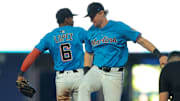 Aug 3, 2025; Miami, Florida, USA; Miami Marlins shortstop Otto Lopez (6) and Miami Marlins left fielder Kyle Stowers (28) celebrate after winning the game against the New York Yankees at loanDepot Park. Mandatory Credit: Sam Navarro-Imagn Images