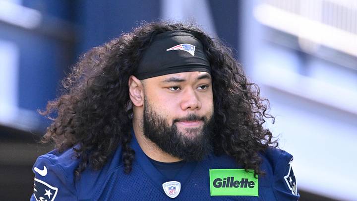 Jul 23, 2025; Foxborough, MA, USA; New England Patriots defensive tackle Khyiris Tonga (95)  walks to the practice field for training camp at Gillette Stadium. Mandatory Credit: Eric Canha-Imagn Images