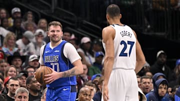 Dec 25, 2024; Dallas, Texas, USA; Dallas Mavericks guard Luka Doncic (77) and Minnesota Timberwolves center and Rudy Gobert (27) during the game between the Dallas Mavericks and the Minnesota Timberwolves at the American Airlines Center. Mandatory Credit: Jerome Miron-Imagn Images