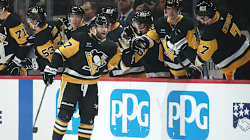 Mar 2, 2025; Pittsburgh, Pennsylvania, USA;  Pittsburgh Penguins right wing Bryan Rust (17) celebrates scoring a goal with the Penguins bench against the Toronto Maple Leafs during the second period at PPG Paints Arena. Mandatory Credit: Charles LeClaire-Imagn Images