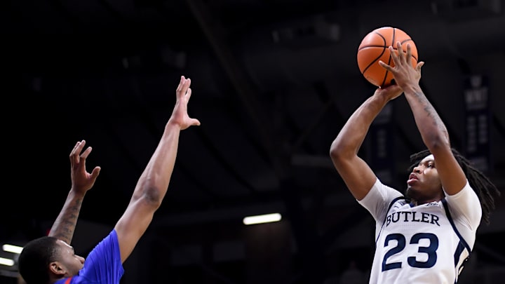 Jan 20, 2026; Indianapolis, Indiana, USA; Butler Bulldogs guard Azavier Robinson (23) shoots the ball against DePaul Blue Demons forward Nj Benson (35) during the second half at Hinkle Fieldhouse. Mandatory Credit: Robert Goddin-Imagn Images