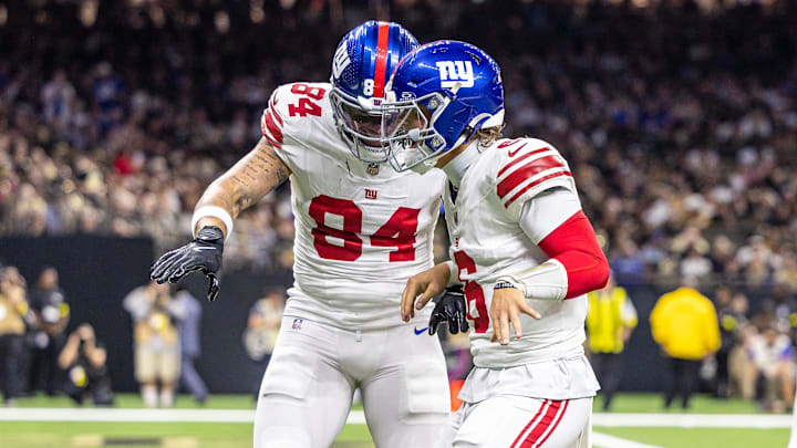 Oct 5, 2025; New Orleans, Louisiana, USA;  New York Giants tight end Theo Johnson (84) and quarterback Jaxson Dart (6) react to a touchdown against New Orleans Saints during the first half at Caesars Superdome. Mandatory Credit: Stephen Lew-Imagn Images