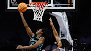 Mar 15, 2025; Fort Worth, TX, USA;  Tulane Green Wave guard Kam Williams (3) scores a layup against Memphis Tigers guard PJ Haggerty (4) during the second half at Dickies Arena.