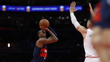 Nov 26, 2024; Washington, District of Columbia, USA; Washington Wizards forward Alexandre Sarr (20) shoots the ball as Chicago Bulls center Nikola Vucevic (9) defends in the second quarter at Capital One Arena. Mandatory Credit: Geoff Burke-Imagn Images