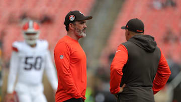 Cleveland Browns head coach Kevin Stefanski, left, chats with a member of the coaching staff before an NFL preseason football game at Cleveland Browns Stadium, Saturday, Aug. 10, 2024, in Cleveland, Ohio.