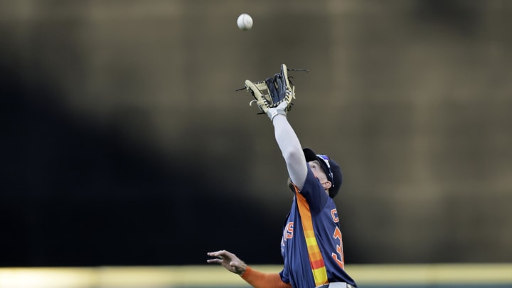 Houston Astros right fielder Trey Cabbage (38) catches a fly hit by Seattle Mariners designated hitter Cal Raleigh (not pictured) during the fourth inning at T-Mobile Park on July 19.