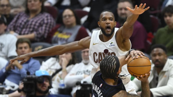 Apr 22, 2024; Cleveland, Ohio, USA; Cleveland Cavaliers forward Evan Mobley (4) defends Orlando Magic forward Paolo Banchero (5) in the fourth quarter during game two of the first round of the 2024 NBA Playoffs at Rocket Mortgage FieldHouse.