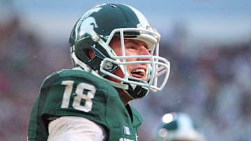 Nov 2, 2013; East Lansing, MI, USA; Michigan State Spartans quarterback Connor Cook (18) celebrates a touchdown during the 2nd half of a game against the Michigan Wolverines at Spartan Stadium. MSU won 29-6. Mandatory Credit: Mike Carter-Imagn Images
