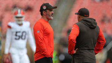Cleveland Browns head coach Kevin Stefanski, left, chats with a member of the coaching staff before an NFL preseason football game at Cleveland Browns Stadium, Saturday, Aug. 10, 2024, in Cleveland, Ohio.