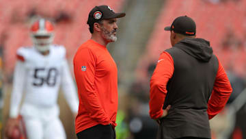 Cleveland Browns head coach Kevin Stefanski, left, chats with a member of the coaching staff before an NFL preseason football game at Cleveland Browns Stadium, Saturday, Aug. 10, 2024, in Cleveland, Ohio.