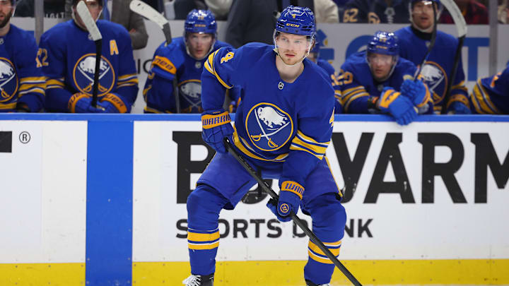 Apr 19, 2026; Buffalo, New York, USA; Buffalo Sabres defenseman Bowen Byram (4) looks to make a pass during the second period against the Boston Bruins in game one of the first round of the 2026 Stanley Cup Playoffs at KeyBank Center. Mandatory Credit: Timothy T. Ludwig-Imagn Images