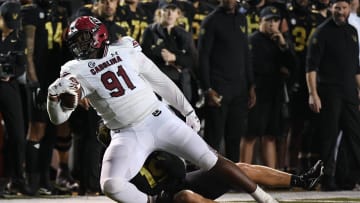 South Carolina football defensive lineman Tonka Hemingway running for a first down after a reception on a special teams trick play