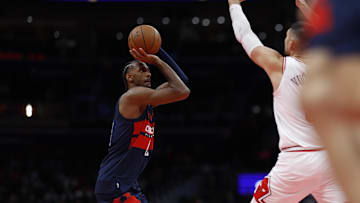 Nov 26, 2024; Washington, District of Columbia, USA; Washington Wizards forward Alexandre Sarr (20) shoots the ball as Chicago Bulls center Nikola Vucevic (9) defends in the second quarter at Capital One Arena. Mandatory Credit: Geoff Burke-Imagn Images