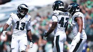 Aug 16, 2025; Philadelphia, Pennsylvania, USA; Philadelphia Eagles linebacker Azeez Ojulari (13) reacts with linebacker Smael Mondon Jr. (42) after a tackle during the second quarter at Lincoln Financial Field.