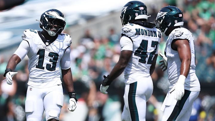 Aug 16, 2025; Philadelphia, Pennsylvania, USA; Philadelphia Eagles linebacker Azeez Ojulari (13) reacts with linebacker Smael Mondon Jr. (42) after a tackle during the second quarter at Lincoln Financial Field.