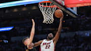Apr 26, 2025; Miami, Florida, USA;Miami Heat forward Andrew Wiggins (22) drives to the basket against Cleveland Cavaliers guard Sam Merrill (5) in the third quarter during game three for the first round of the 2025 NBA Playoffs at Kaseya Center. Mandatory Credit: Sam Navarro-Imagn Images