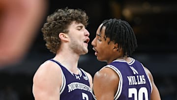 Mar 12, 2025; Indianapolis, IN, USA; Northwestern Wildcats forward Nick Martinelli (2) and Northwestern Wildcats guard Justin Mullins (20) celebrate after a play during the second half against the Minnesota Golden Gophers at Gainbridge Fieldhouse. Mandatory Credit: Robert Goddin-Imagn Images