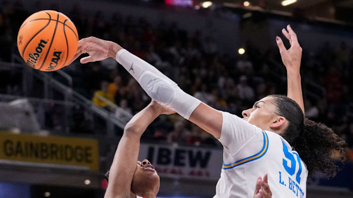 UCLA Bruins center Lauren Betts (51) blocks a basket attempt by Ohio State Buckeyes guard Kennedy Cambridge (3) on Saturday, March 7, 2026, during a Big Ten women's basketball tournament semifinals game at Gainbridge Fieldhouse in Indianapolis.