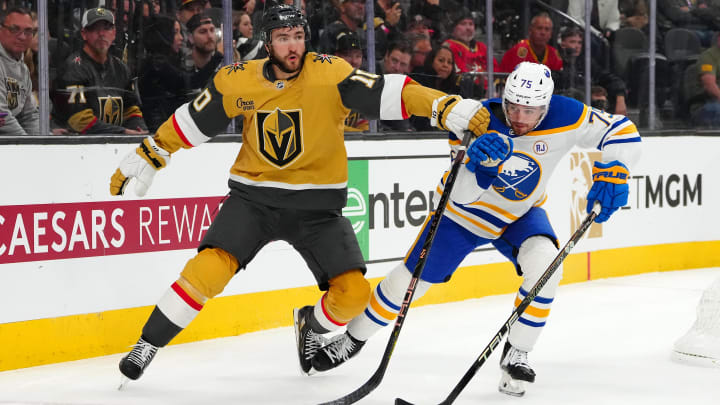 Dec 15, 2023; Las Vegas, Nevada, USA; Vegas Golden Knights center Nicolas Roy (10) attempts to slow down Buffalo Sabres defenseman Connor Clifton (75) during the second period at T-Mobile Arena. Mandatory Credit: Stephen R. Sylvanie-USA TODAY Sports