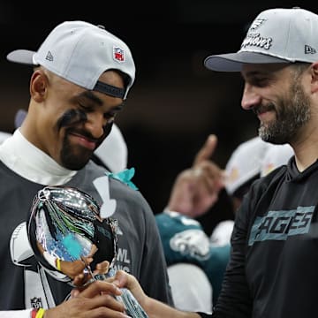 Feb 9, 2025; New Orleans, LA, USA; Philadelphia Eagles quarterback Jalen Hurts holds the Lombardi Trophy while standing next to Eagles head coach Nick Sirianni (R) during the championship trophy presentation after the Eagles' game against the Kansas City Chiefs in Super Bowl LIX at Caesars Superdome. Mandatory Credit: Geoff Burke-Imagn Images