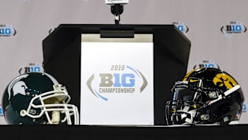 Dec 5, 2015; Indianapolis, IN, USA; General view of helmets at the press conference table prior to the game between the Michigan State Spartans and the Iowa Hawkeyes in the Big Ten Conference football championship at Lucas Oil Stadium. Mandatory Credit: Shanna Lockwood-Imagn Images