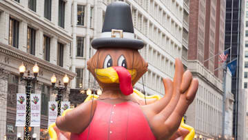 A turkey parade balloon on Thanksgiving