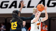 Oklahoma State Cowgirls guard Anna Gret Asi (4) makes a 3-pointer beside Arizona State Sun Devils guard Jalyn Brown (23) during a women's college basketball game between the Oklahoma State Cowgirls (OSU) and the Arizona State Sun Devils at Gallagher-Iba Arena in Stillwater, Okla., Wednesday, Jan. 29, 2025.
