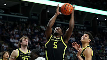 Jan 12, 2025; University Park, Pennsylvania, USA; Oregon Ducks guard TJ Bamba (5) reaches for the rebound during the first half against the Penn State Nittany Lions at Bryce Jordan Center. Oregon defeated Penn State 82-81.