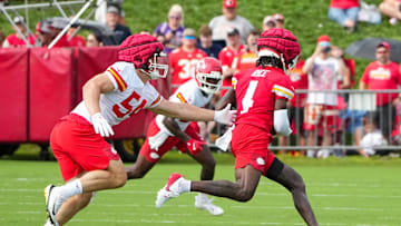 Jul 22, 2025; St. Joseph, MO, USA; Kansas City Chiefs wide receiver Rashee Rice (4) catches a pass as linebacker Leo Chenal (54) defends during training camp at Missouri Western State University. Mandatory Credit: Denny Medley-Imagn Images